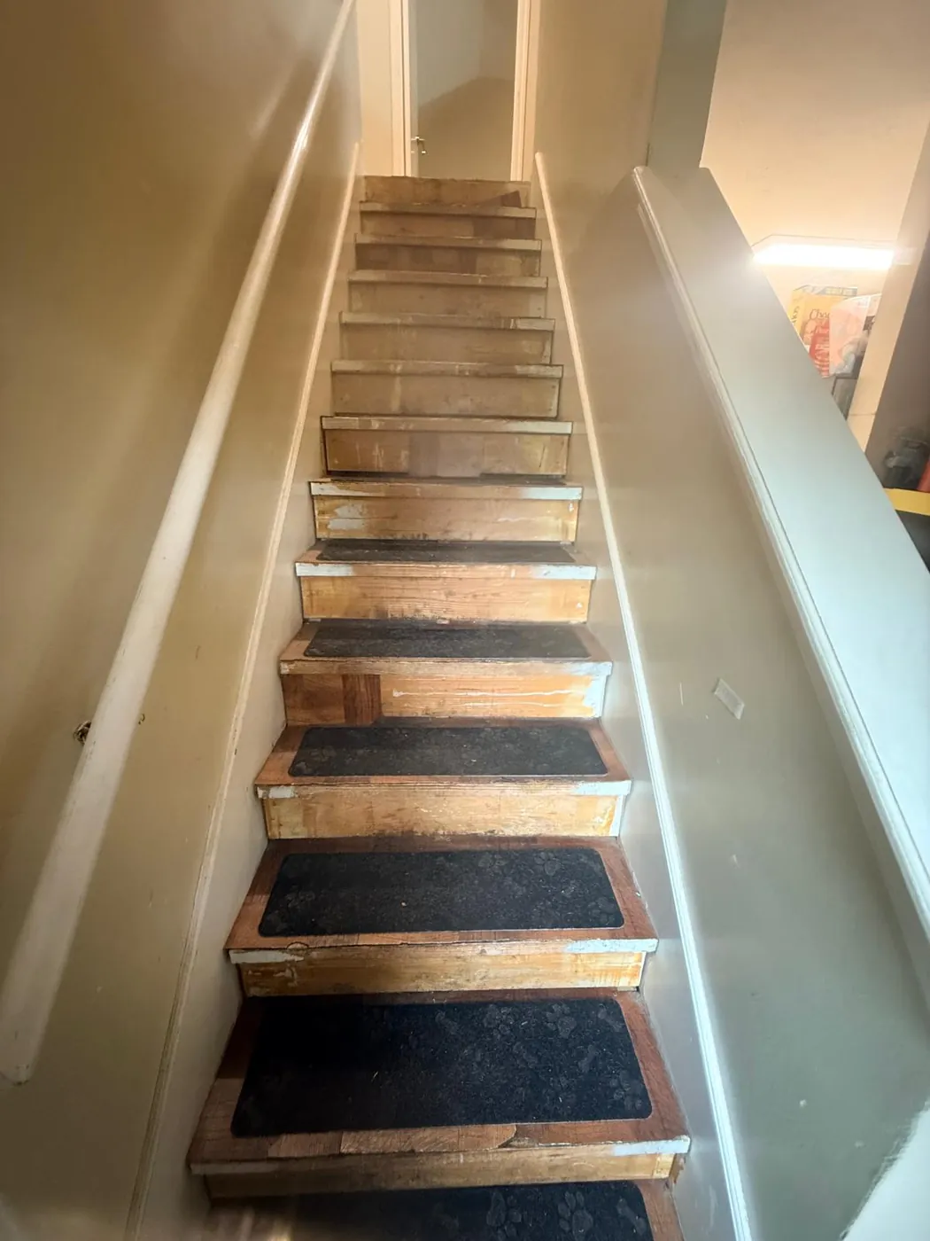 During: stairs stripped and rebuilt tread by tread.