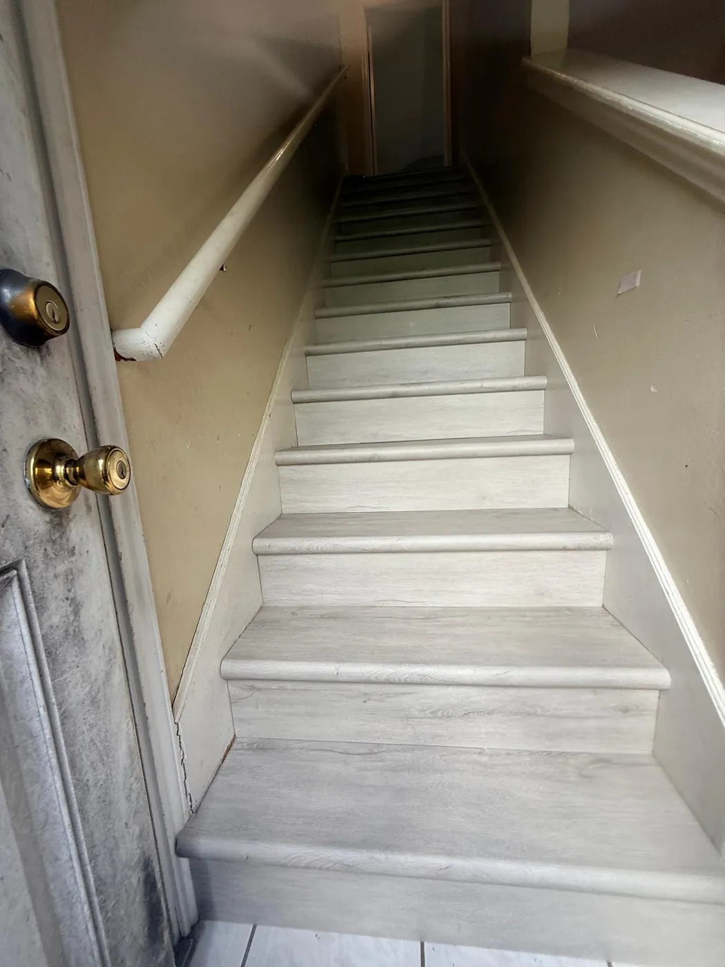 After: the same staircase finished and solid.